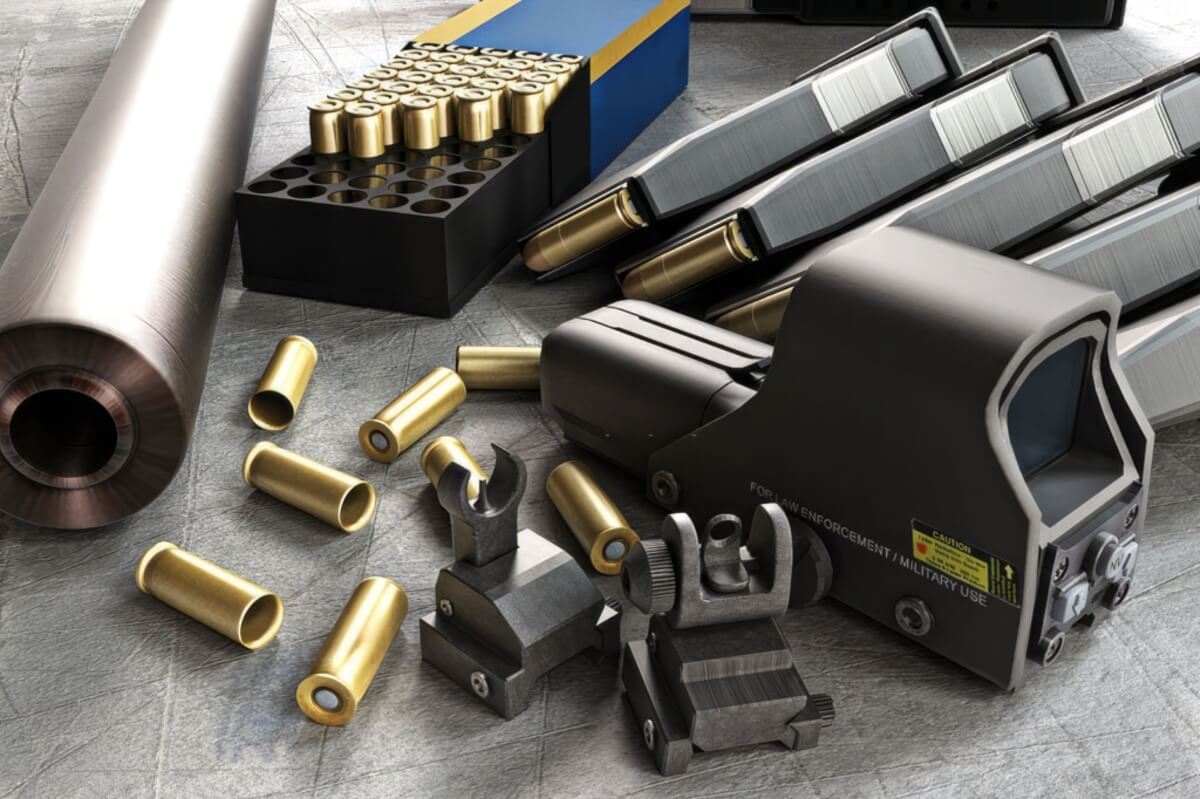 A display of firearm accessories including sights and magazines
