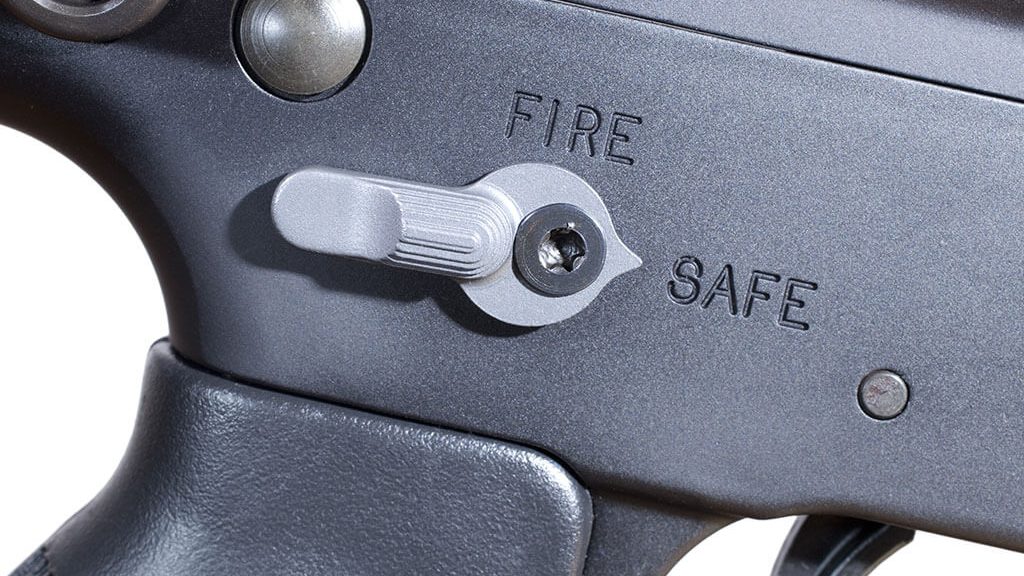 Close up image of a gun safety in the safe position