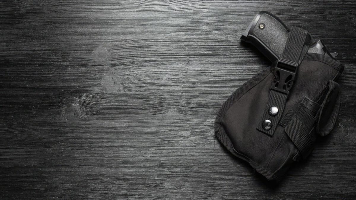 An image of a handgun in a holster