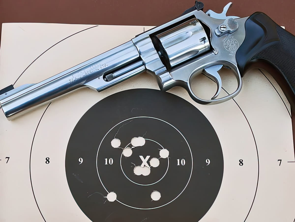 A Revolver On A Target With Accurate Bullet Holes